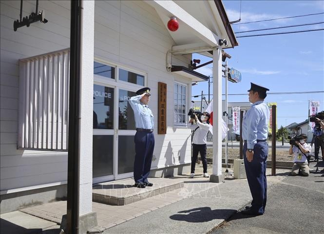 Buổi lễ đánh dấu ngày bốt gác cảnh sát tại thị trấn Futaba thuộc tỉnh Fukushima, Nhật Bản mở cửa trở lại sau hơn 11 năm đóng cửa do thảm họa động đất và sóng thần, ngày 29/8/2022. Ảnh: Kyodo