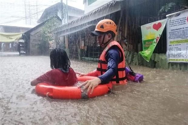 Mưa lớn do ảnh hưởng của bão nhiệt đới Rai gây ngập lụt nhiều khu vực tại Cagayan de Oro, phía nam đảo Mindanao (Philippines), ngày 16/12/2021. (Ảnh: AFP/TTXVN)