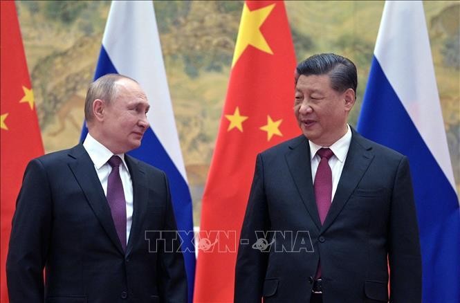Tổng thống Nga Vladimir Putin (trái) và Chủ tịch Trung Quốc Tập Cận Bình tại cuộc gặp ở Bắc Kinh, ngày 4/2/2022. Ảnh: AFP/TTXVN